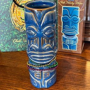 Disneyland Club 33 Mardi Gras tiki mug by SHAG.   Blue 8” tall, 2.5” circum.